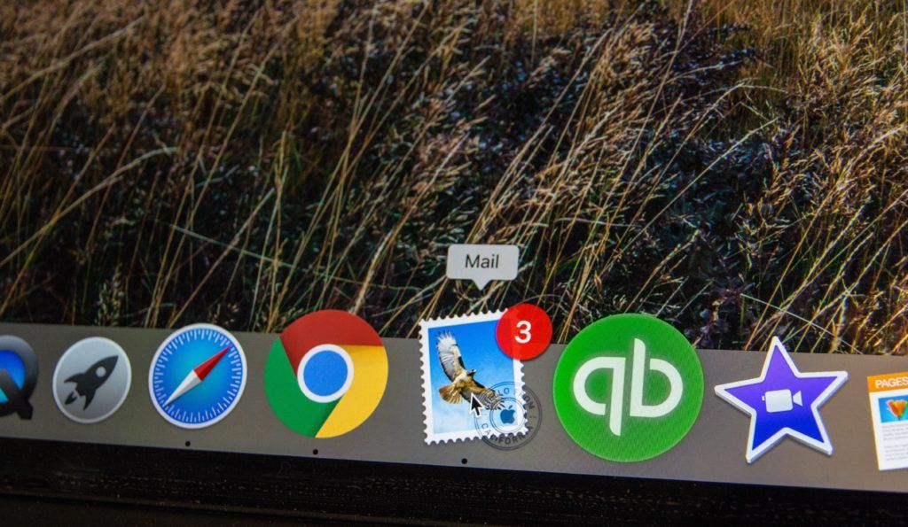 Photo of the app bar on a mac computer, showing the email icon highlighted with 3 pending email messages